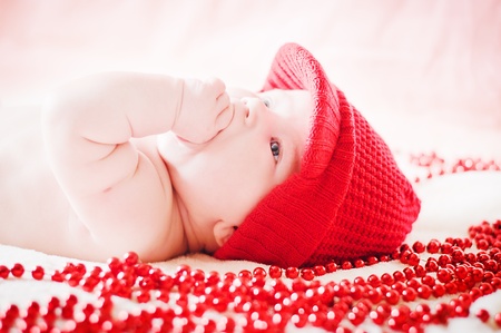 cute baby in red winter hatの写真素材