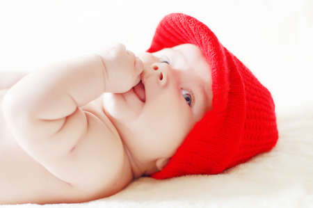 cute baby in red winter hatの写真素材