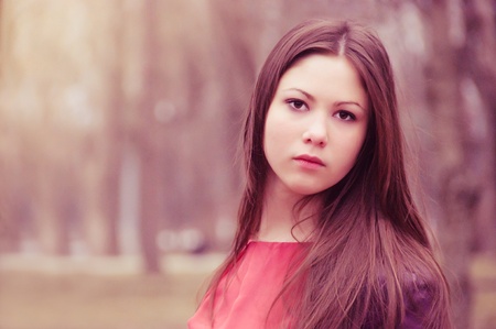 Portrait of the charming young woman with a sad sightの写真素材