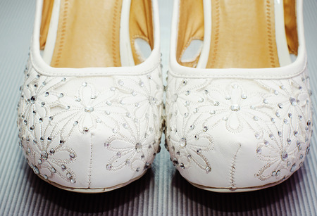 Elegant white wedding shoesの写真素材