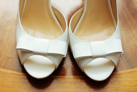 Elegant wedding shoes over gradient gray backgroundの写真素材