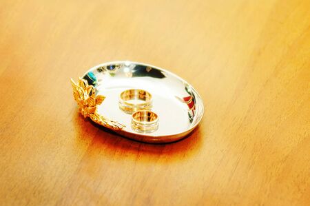 Two wedding rings on table for couplesの写真素材