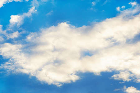 blue sky background with tiny white clouds