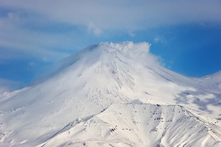 Volcano with snow in winter day in Russia on Kamchatkaの写真素材