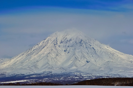 Volcanic landscape of Kamchatka: winter view of eruption Klyuchevskaya Sopkaの写真素材