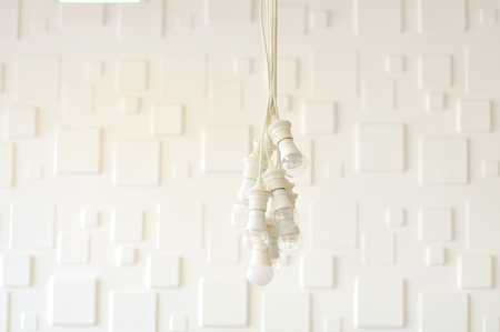 White beautiful chandelier against the white ceilingの写真素材