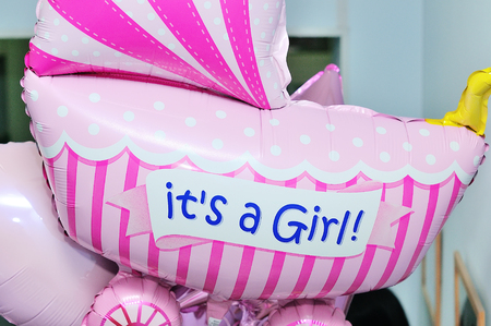Decorations on birthday. Fun balloon it is a girl.の写真素材