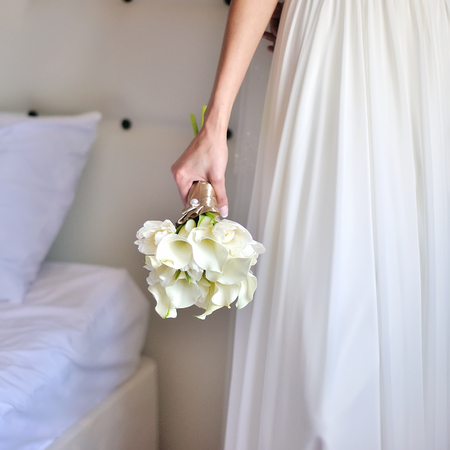 Wedding. Beautiful bride with bouquet in happy dayの写真素材