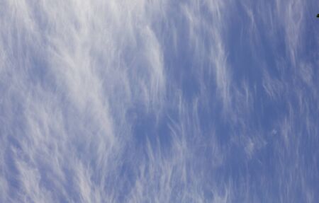 cumulus white clouds against a beautiful blue sky, bizarre patternsの写真素材