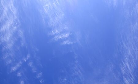 cumulus white clouds against a beautiful blue sky, bizarre patternsの写真素材
