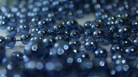 Blue beads with large beads. Christmas decorations. New year background.
