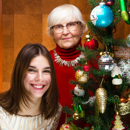 new year. senior grandma and young caucasian woman, teenagerの写真素材