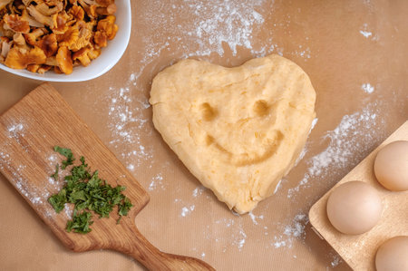 composition of eggs, dough and mushrooms on a beige background. A set of products for cooking.の写真素材