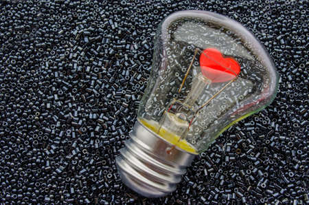 Love concept - red heart of an electric bulbの写真素材