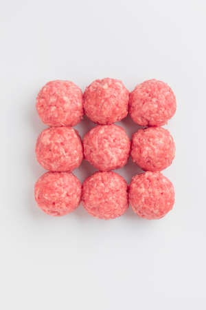 Top view of 9 raw meatballs isolated on white backgroundの写真素材