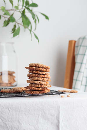 Stack of homemade oat cookies on a tableの写真素材