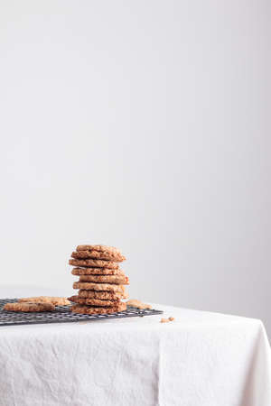 Stack of homemade oat cookies on a tableの写真素材