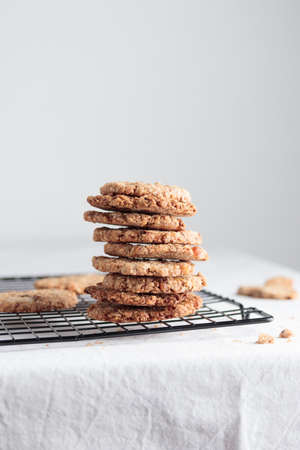 Stack of homemade oat cookies on a tableの写真素材