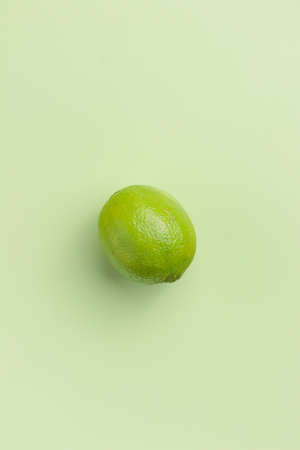 Lime on a green background top viewの写真素材