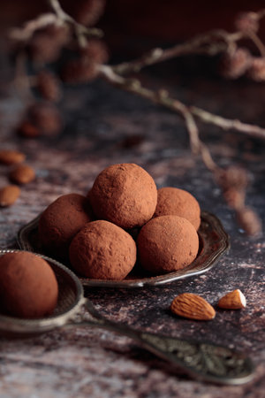 Homemade dates candies with cocoa closeup