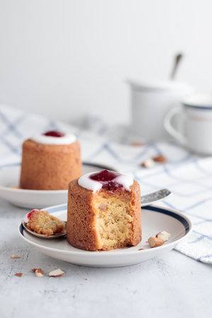 Runebergin Torttuu in a plate on a white table verticalの写真素材
