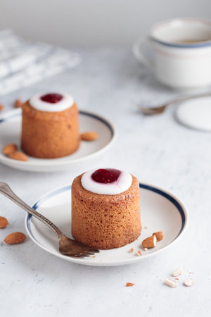 Runebergin Torttuu in a plate on a white table verticalの写真素材