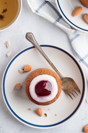 Runebergin Torttuu in a plate on a white table verticalの写真素材