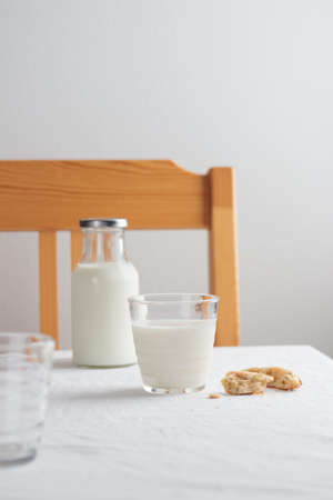 Fresh Milk on the table with white tablecloth and white wallの写真素材