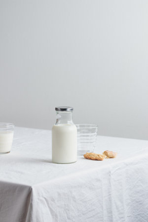 Fresh Milk on the table with white tablecloth and white wallの写真素材