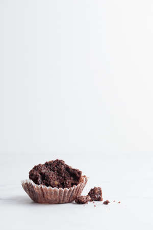 Started chocolate muffin on a white background copy space