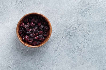 Natural eco dried cranberries top view on a gray backgroundの写真素材