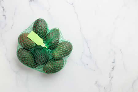 an avocado bag on a white background copy space
