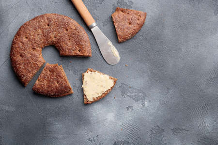 Reikaleipa - traditional finnish rye bread on a gray concrete background