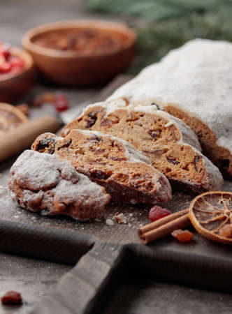 Traditional christmas Shtollen cake on a gray backgroundの写真素材