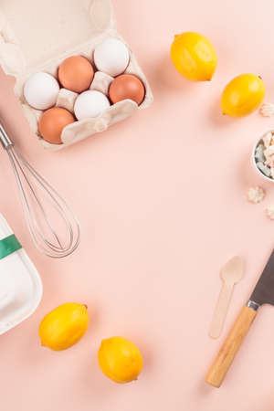 Frame of food ingredients for baking on a gently pink pastel backgroundの写真素材