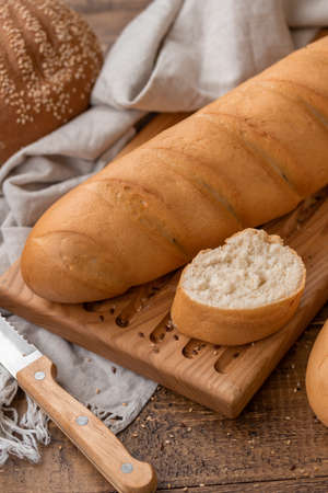 Natural bread loaf on wooden background