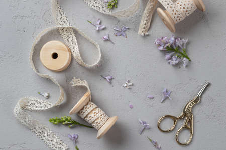 Spring Gray Background with flowers and ribbons on a gray backgroundの写真素材