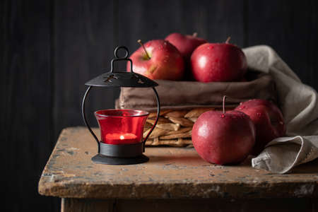 Red apples in a basket on a dark background verticalの写真素材