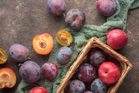 Fresh ripe plums on a dark backgroundの写真素材