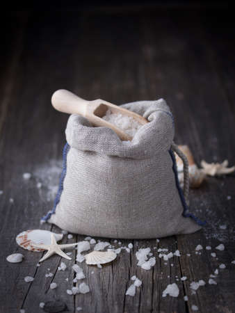 Sea salt crystals with seashells on a dark backgroundの写真素材