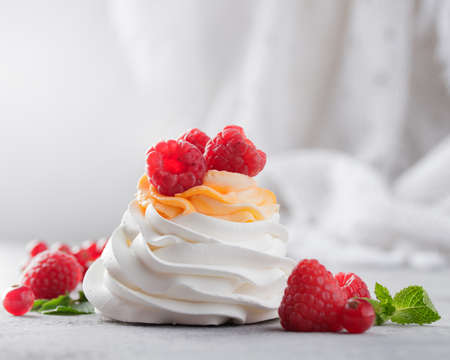 Pavlova dessert with berries on a gray backgroundの写真素材