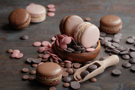 Macaroons with a chocolate drops on a wooden backgroundの写真素材