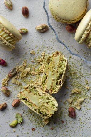 Pistachio flour and green macaroons on a gray backgroundの写真素材