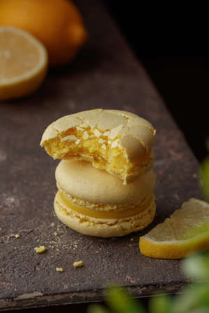 Lemon macaroons on a dark background macro
