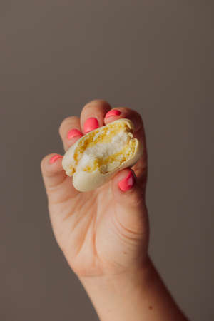 French macaroons in woman's handの写真素材