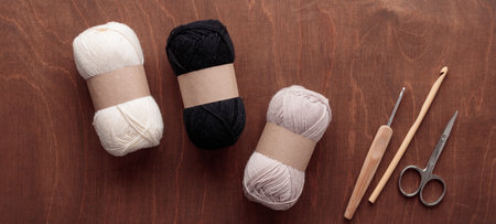 Cotton Yarn Skeins for Crocheting Handmade on a Dark Wooden background with a copyspace top view