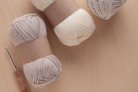Light eco cotton Yarn Skeins for Crocheting Handmade on a Light Colored Wooden background with a...