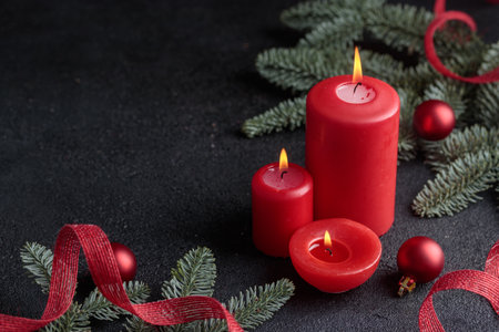 Red candles on dark background Horizontal with copyspaceの写真素材