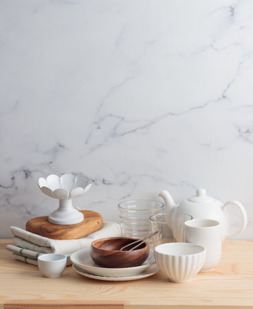 Empty tableware - white plate, a bowl and a cup on wooden table vertical photoの写真素材