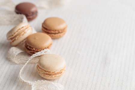 Colorful pastel eco handmade natural macaroons on white background. Gift for 8 March, International Women's Day, Valentine's Day. Horizontal banner closeup with a copyspaceの写真素材